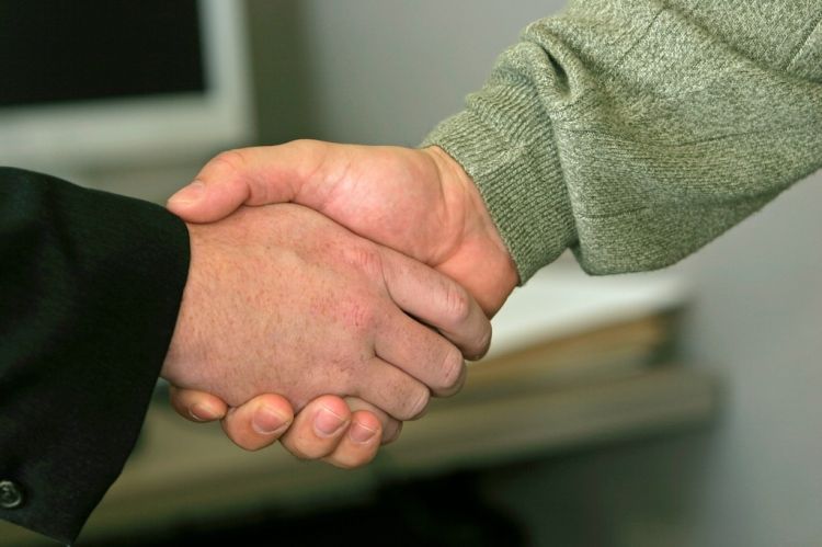two people shaking hands