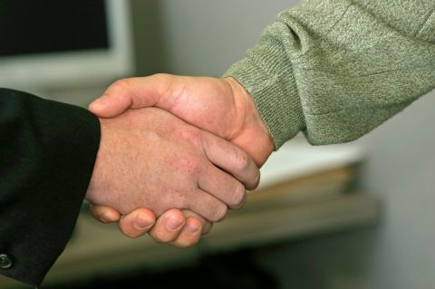 two people shaking hands